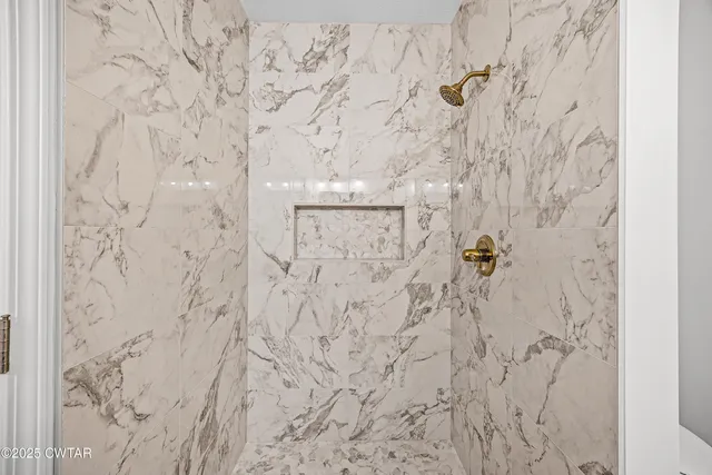 a bathroom with a shower curtain