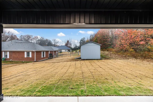 a view of empty room with a fireplace