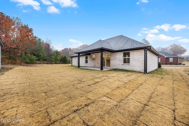 a house with trees in front of it