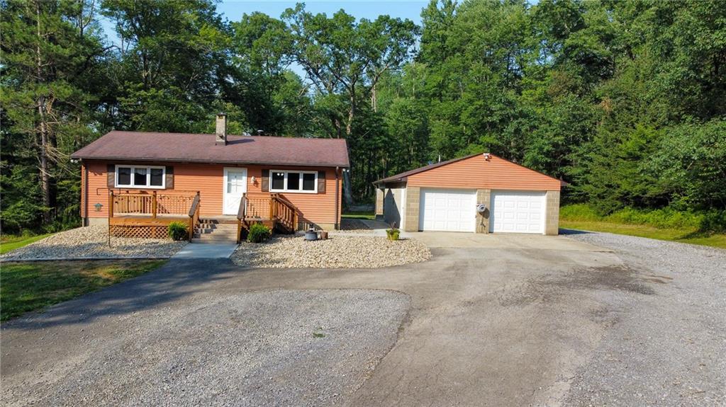435 Grubb Road Boyers, PA 16020 - Photo 1 of 37 a front view of a house with a garden