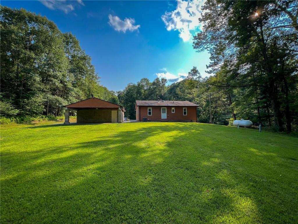 435 Grubb Road Boyers, PA 16020 - Photo 33 of 37 a front view of a house with a garden