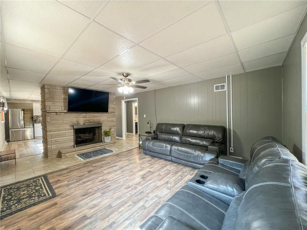 435 Grubb Road Boyers, PA 16020 - Photo 5 of 37 a living room with furniture a flat screen tv and a fireplace