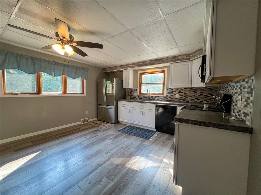 435 Grubb Road Boyers, PA 16020 - Photo 7 of 37 a kitchen with granite countertop a stove a sink and a refrigerator
