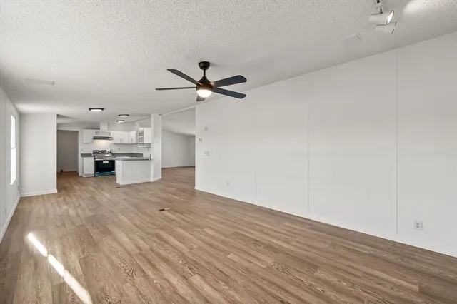 a view of a kitchen with a sink and a stove top oven