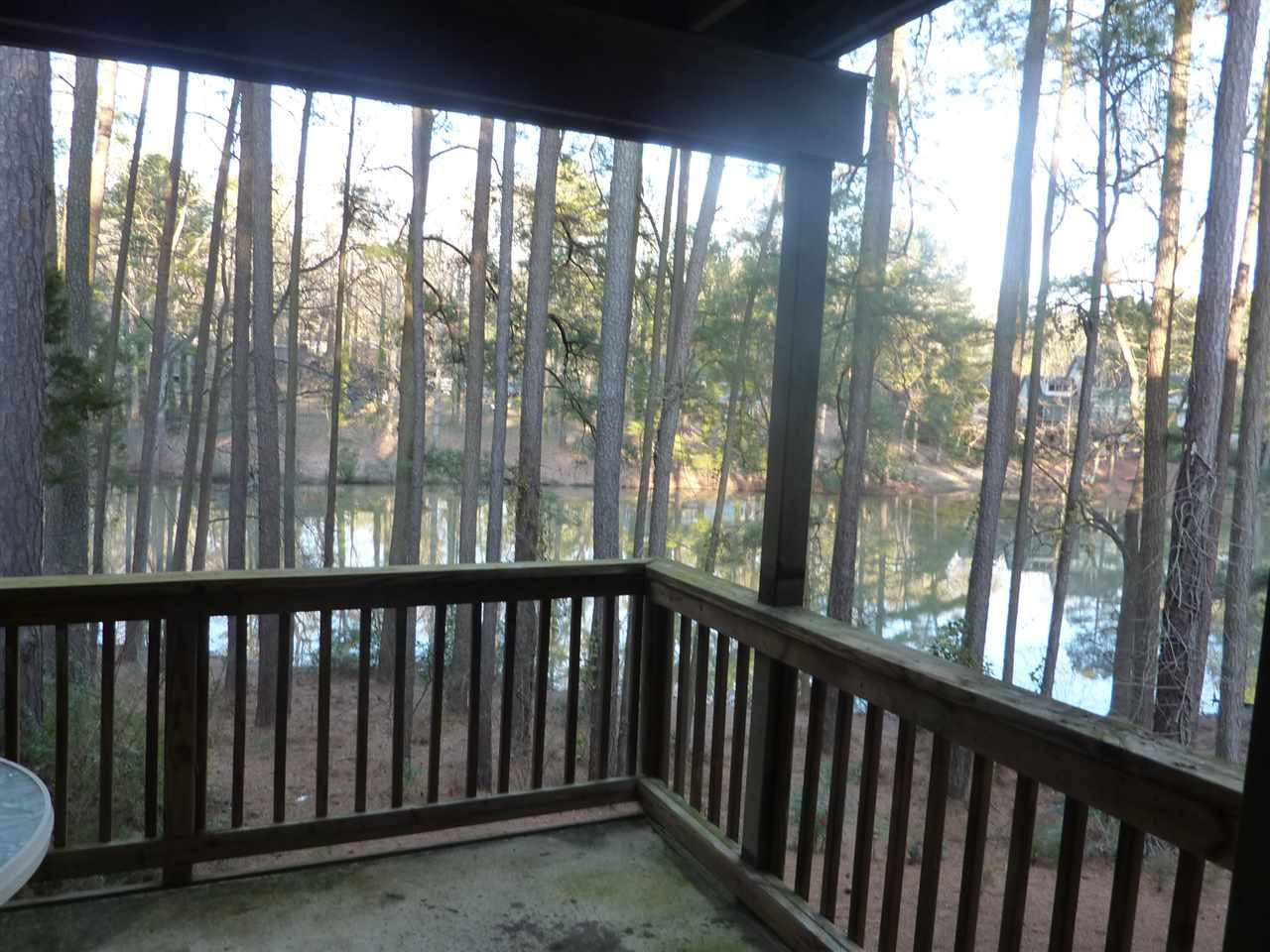 683 Pine Ridge Place, Unit 683 Raleigh, NC 27609 - Photo 3 of 12 The balcony sets the perfect outdoor scene to enjoy the natural surroundings! Exterior Back
