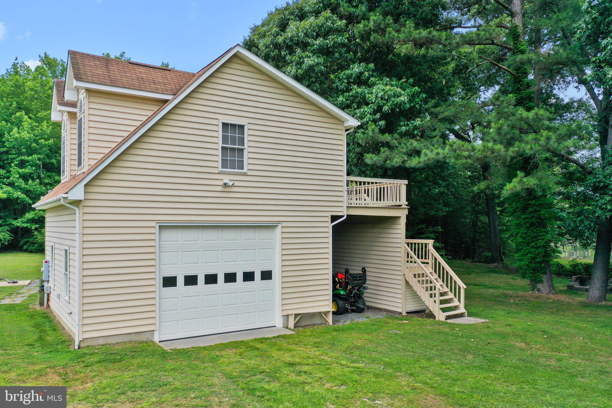 367 Edgewater Lane Montross, VA 22520 - Photo 56 of 64 Side load garage, lean-to & stairs to apartment.