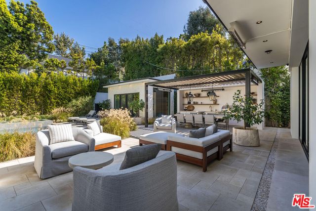 a outdoor living space with furniture and garden view