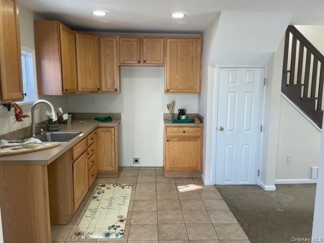 100 Dunderberg Road Putnam Valley, NY 10579 - Photo 11 of 29 a kitchen with a sink a stove and cabinets