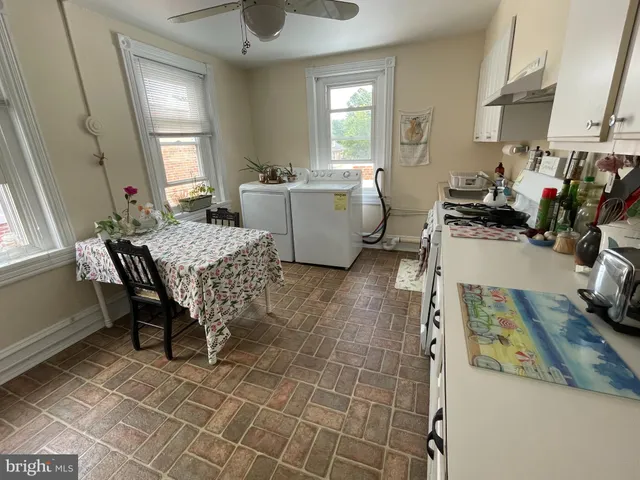 a room with furniture a window and gym equipment