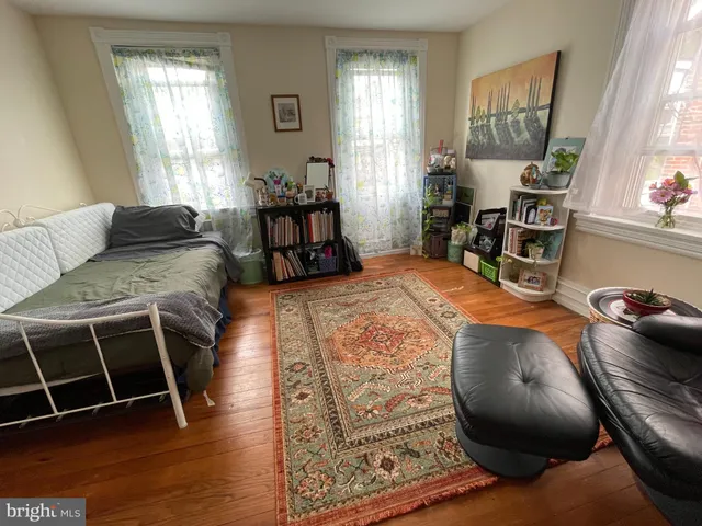 a bed room with a bed and a chair