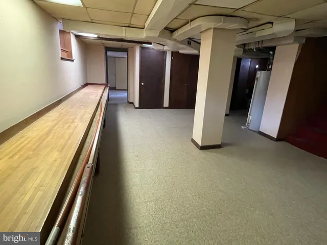 a view of a hallway with stairs