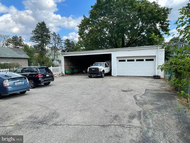 a view of garage with parked cars