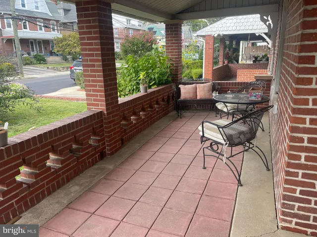 a sitting area with furniture and a yard