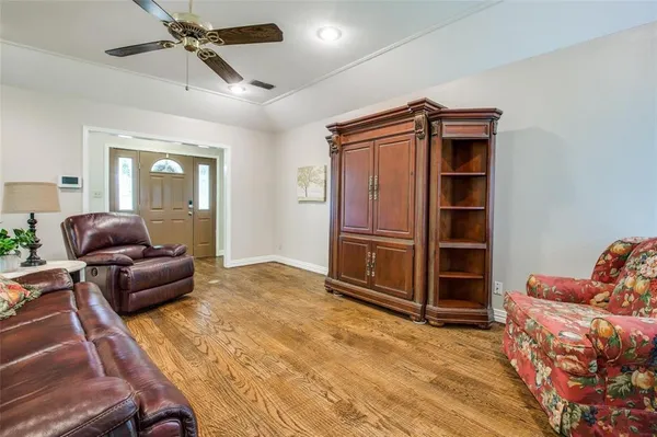 a livingroom with furniture and staircase