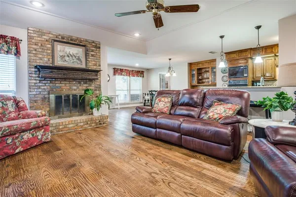 a living room with furniture and a fireplace