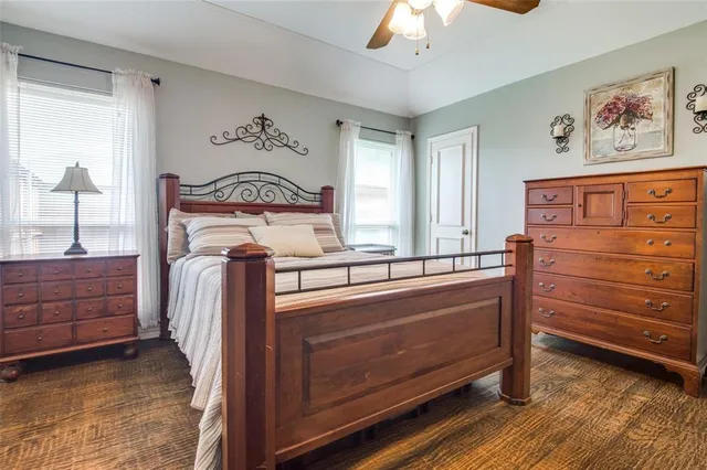 a bed room with a bed and a window