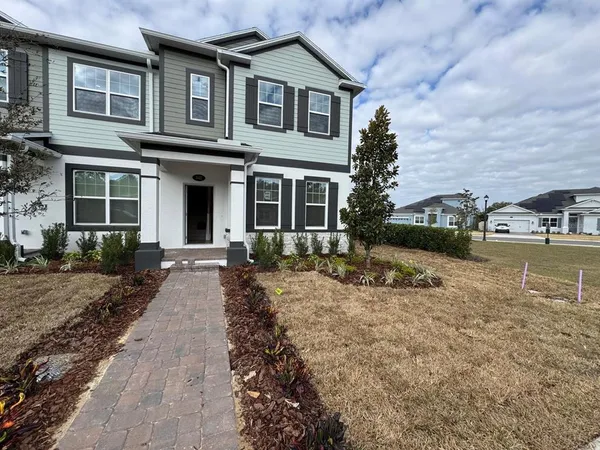 a front view of a house with a yard