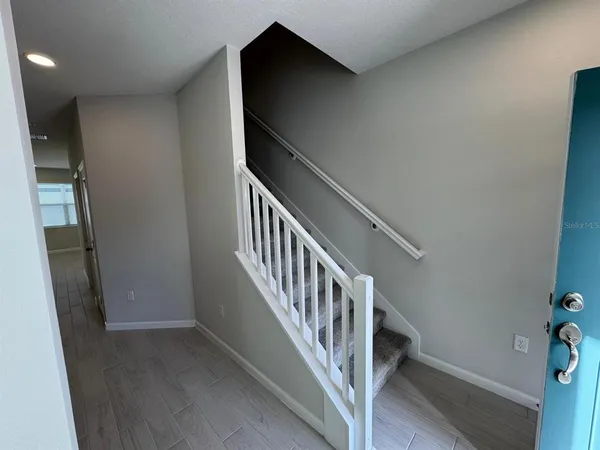 a view of entryway with stairs