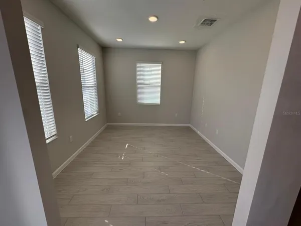 an empty room with windows