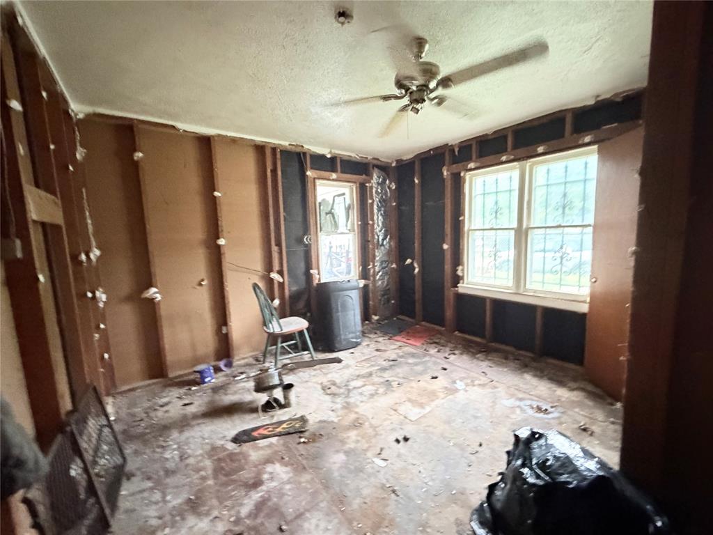 5054 Flamingo Road Fort Worth, TX 76119 - Photo 12 of 15 a view of a room with gym equipment and windows