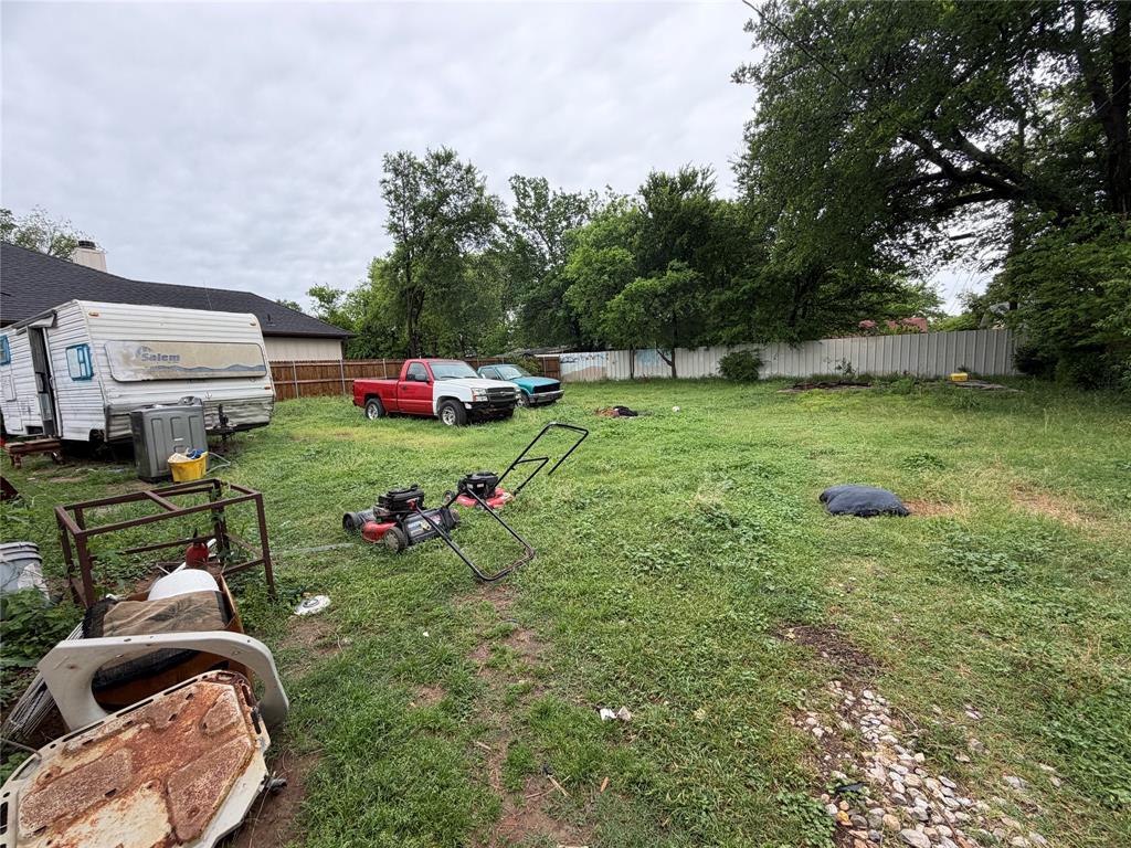 5054 Flamingo Road Fort Worth, TX 76119 - Photo 14 of 15 a backyard of a house with seating space