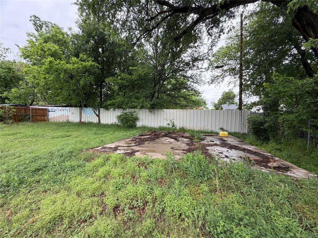 5054 Flamingo Road Fort Worth, TX 76119 - Photo 15 of 15 a view of a backyard with a small cabin