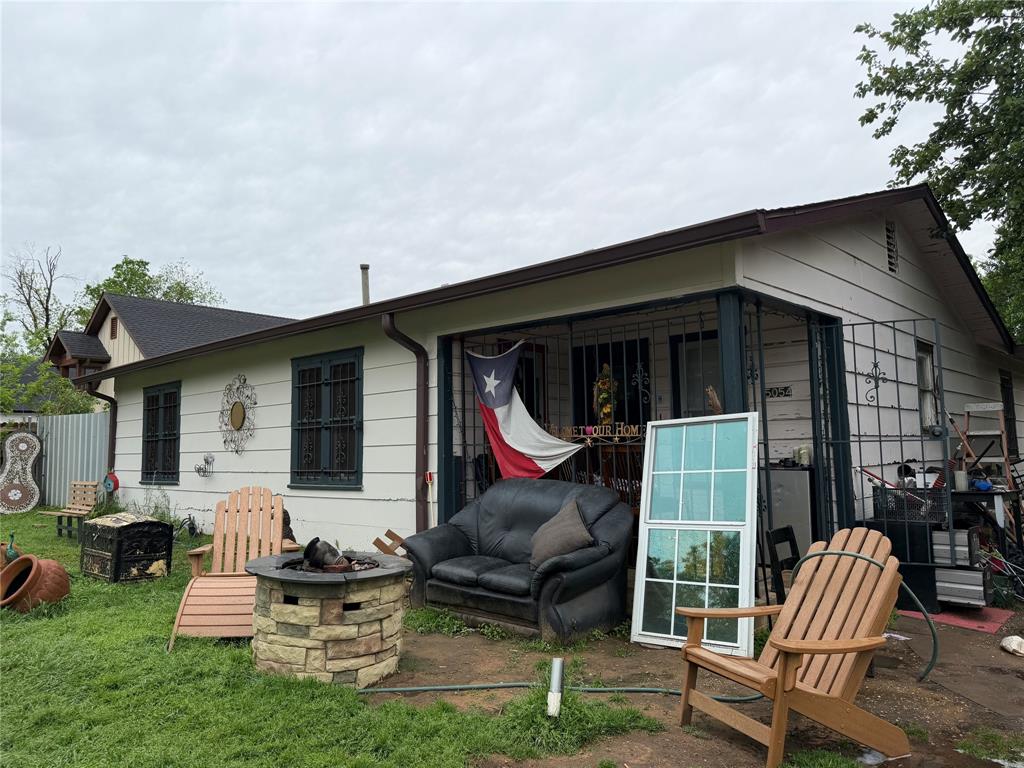 5054 Flamingo Road Fort Worth, TX 76119 - Photo 2 of 15 a view of house with backyard and outdoor seating