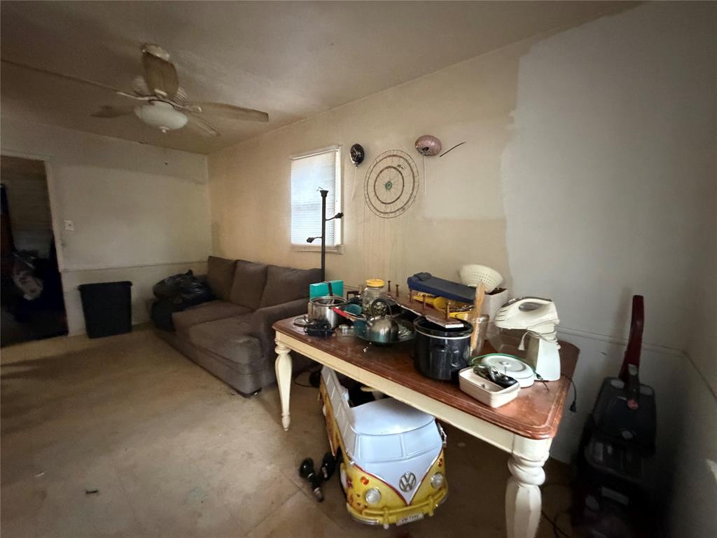 5054 Flamingo Road Fort Worth, TX 76119 - Photo 4 of 15 a living room with furniture and a flat screen tv