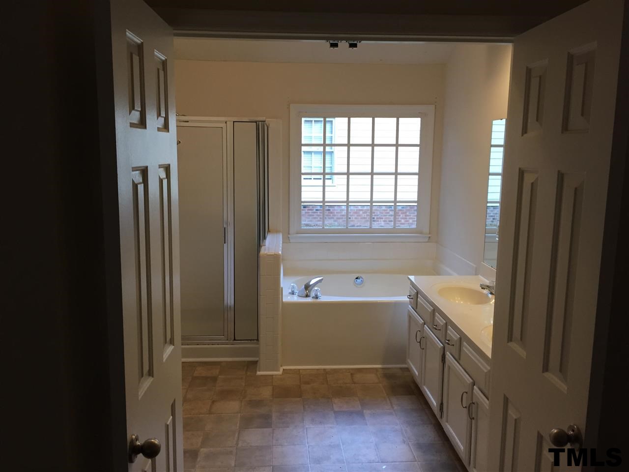 3541 Dechart Lane Raleigh, NC 27616 - Photo 6 of 9 a bathroom with a tub sink and mirror