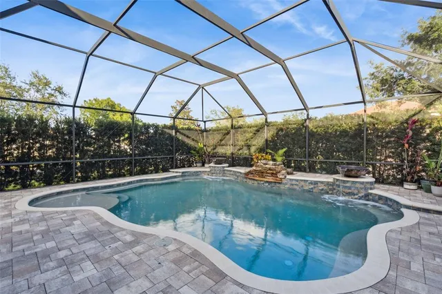 a view of a swimming pool with a yard