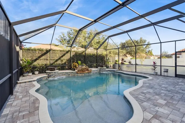 a view of a swimming pool with a yard