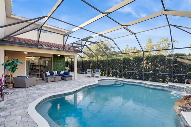 a view of a swimming pool with a patio