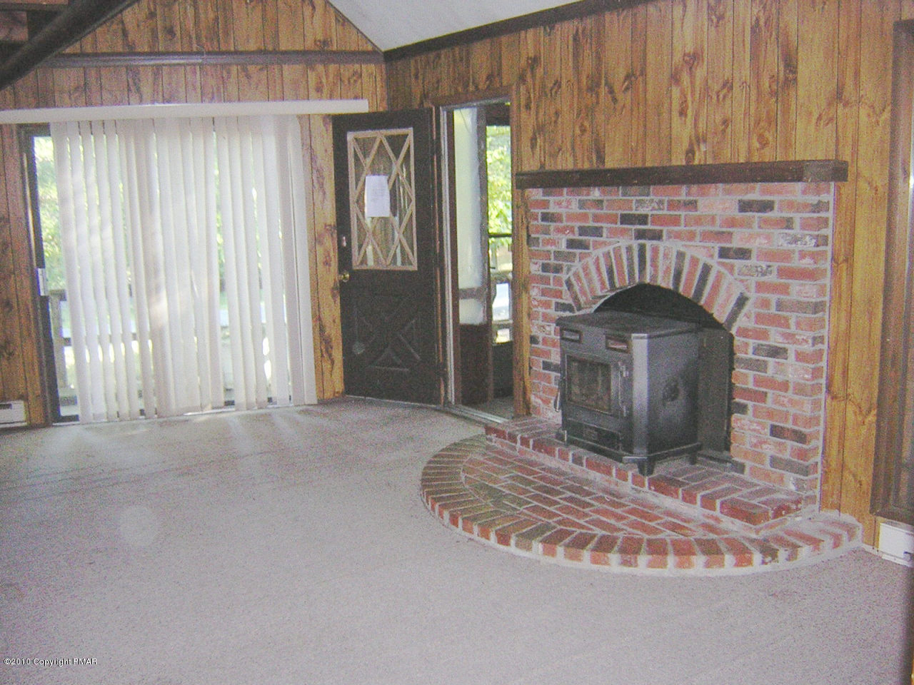 937 Decker Road Bushkill, PA 18324 - Photo 3 of 4 a living room with fireplace and a fireplace