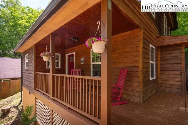 a view of a house with a small deck