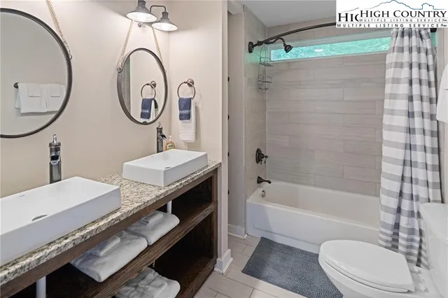 a view of hallway with wooden floor