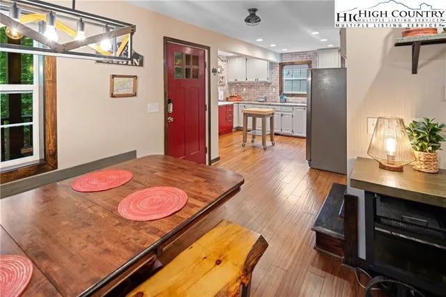 a kitchen with a sink a window a counter top space and stainless steel appliances