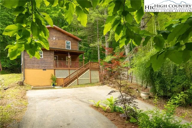 a view of a brick house with a large window