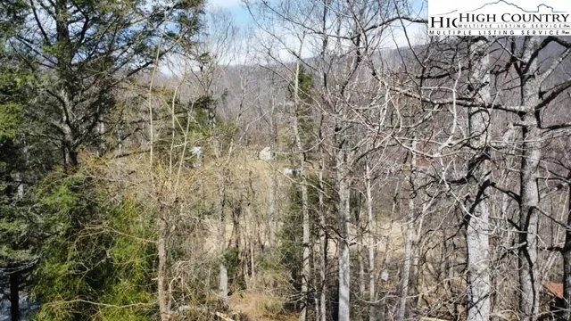 an aerial view of a house with a yard and garden