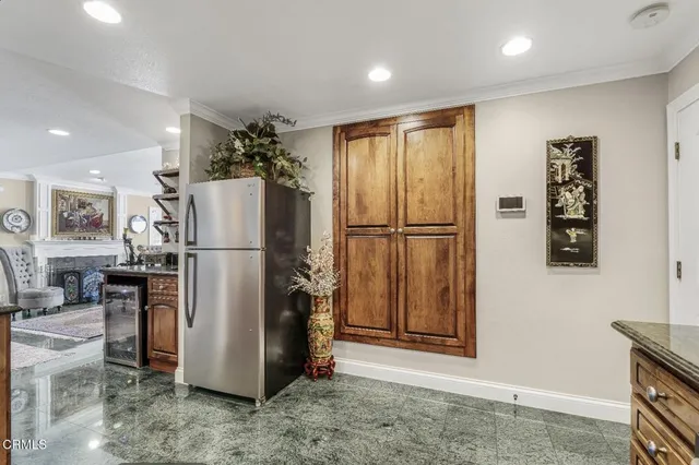 a refrigerator freezer sitting inside of a kitchen