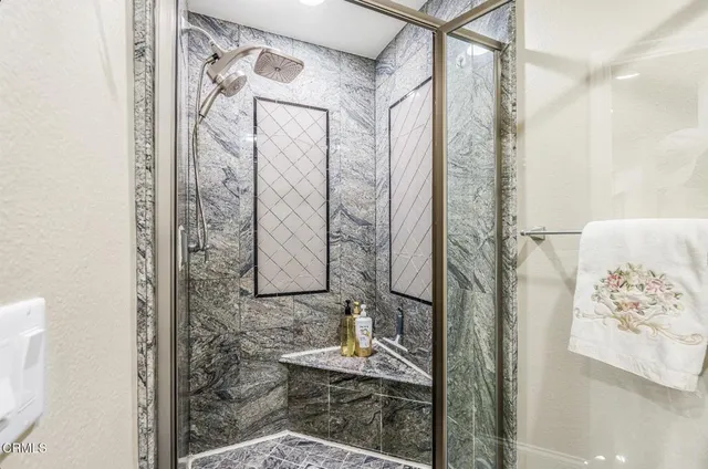 a bathroom with a shower curtain and a sink