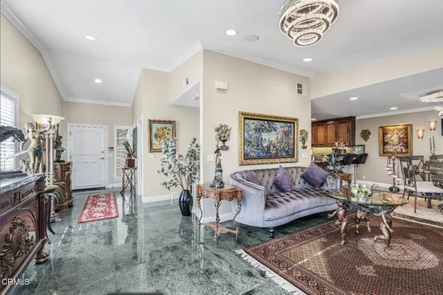 a living room with furniture and a table