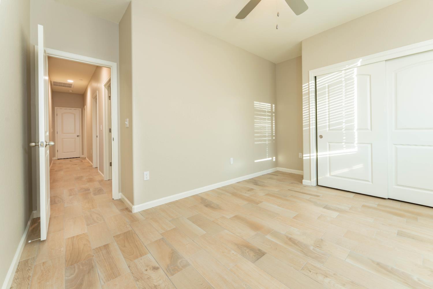 30480 Bellwood Road Visalia, CA 93291 - Photo 33 of 37 an empty room with fan and windows