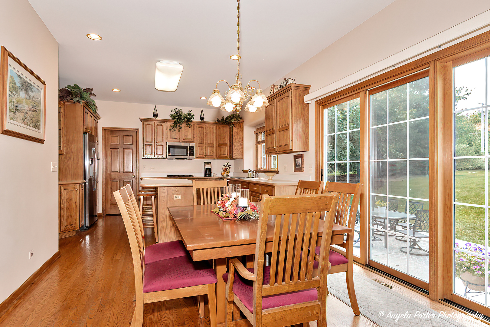 471 White Oaks Drive Cary, IL 60013 - Photo 14 of 39 a view of a dining room with furniture and wooden floor