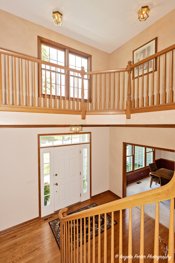 471 White Oaks Drive Cary, IL 60013 - Photo 20 of 39 a bedroom with a bed and a window