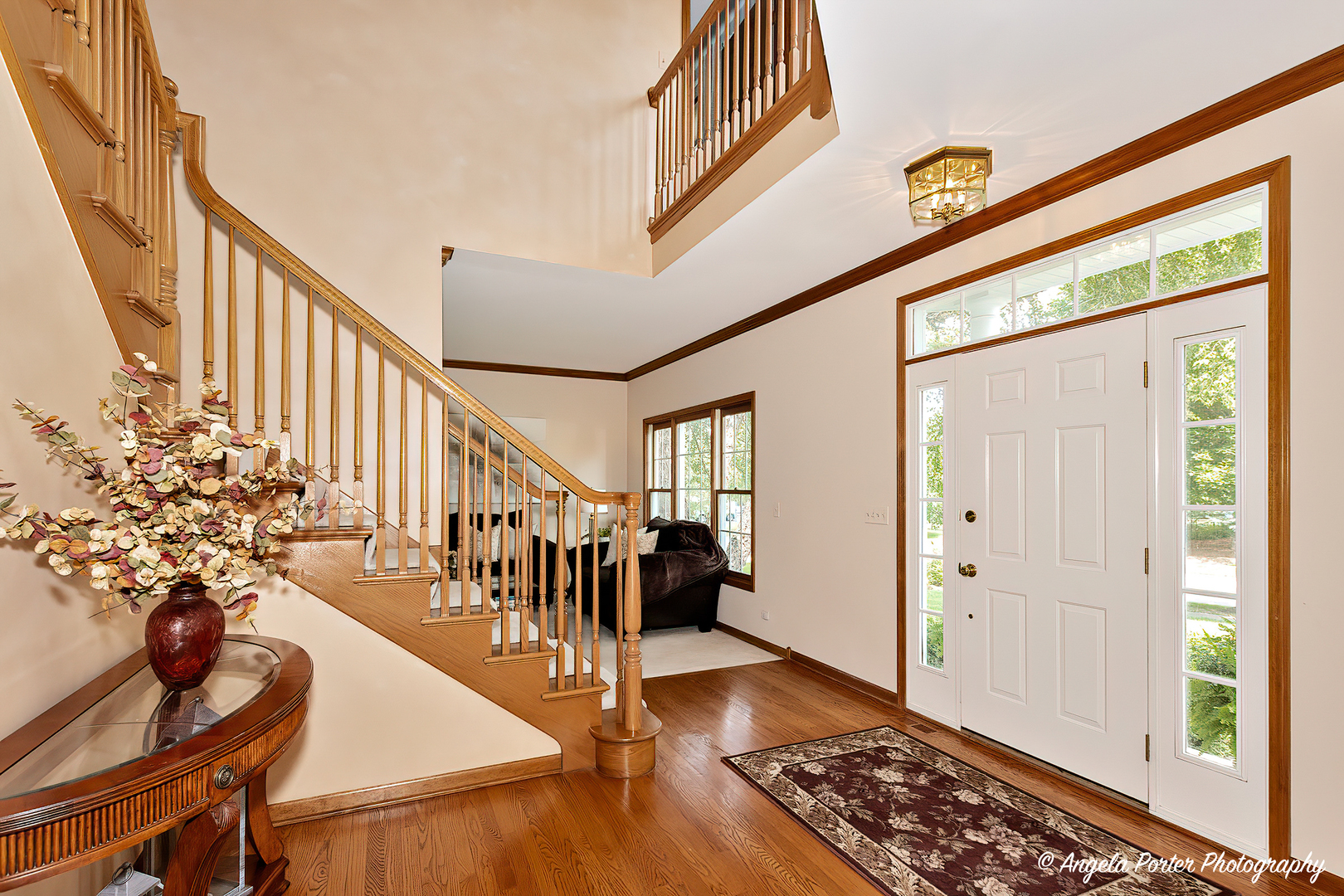 471 White Oaks Drive Cary, IL 60013 - Photo 2 of 39 a very nice looking room with wooden floor and stairs
