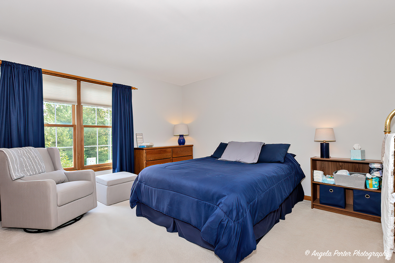 471 White Oaks Drive Cary, IL 60013 - Photo 22 of 39 a bedroom with a bed and a couch next to a window