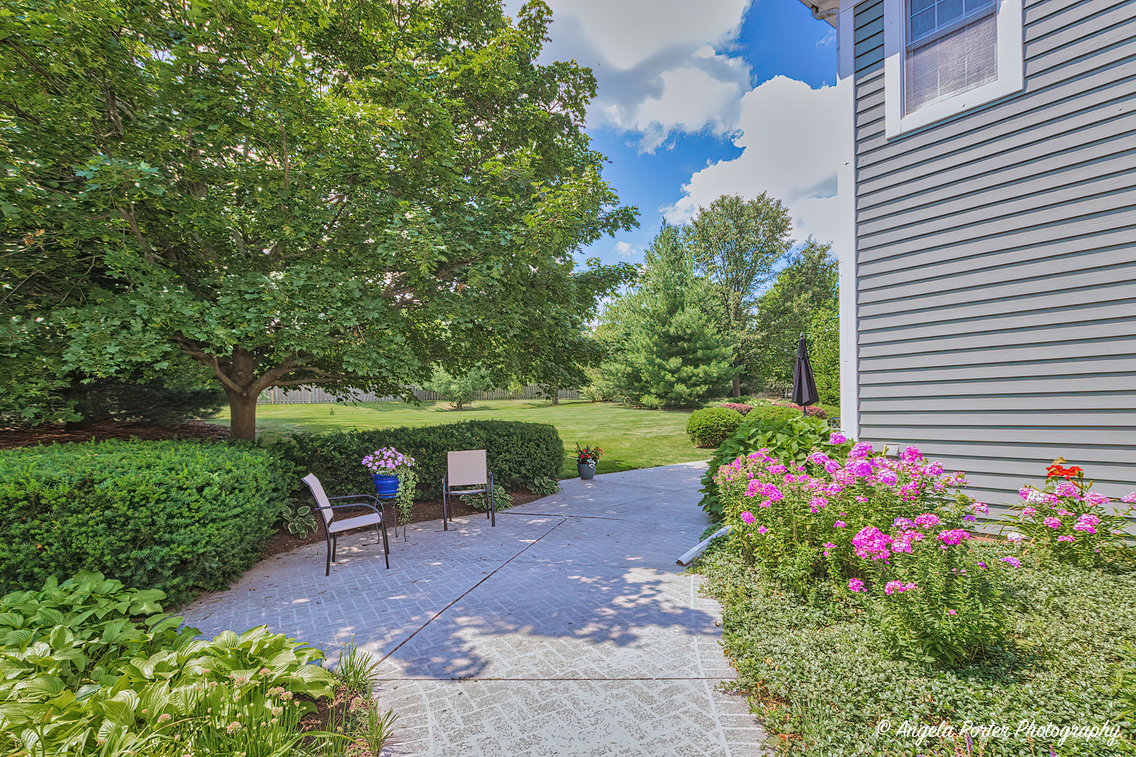 471 White Oaks Drive Cary, IL 60013 - Photo 35 of 39 a view of a chair and table in the garden front of the house