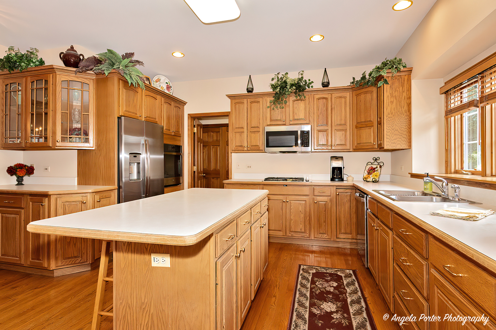 471 White Oaks Drive Cary, IL 60013 - Photo 10 of 39 a kitchen with a sink appliances and cabinets
