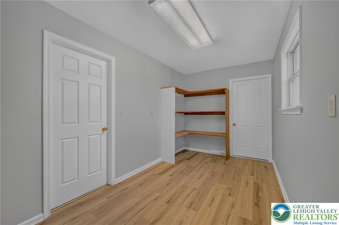 630 Clearfield Road Nazareth, PA 18064 - Photo 69 of 100 Gleaming wood floors and built-in shelving define this versatile storage or utility space.