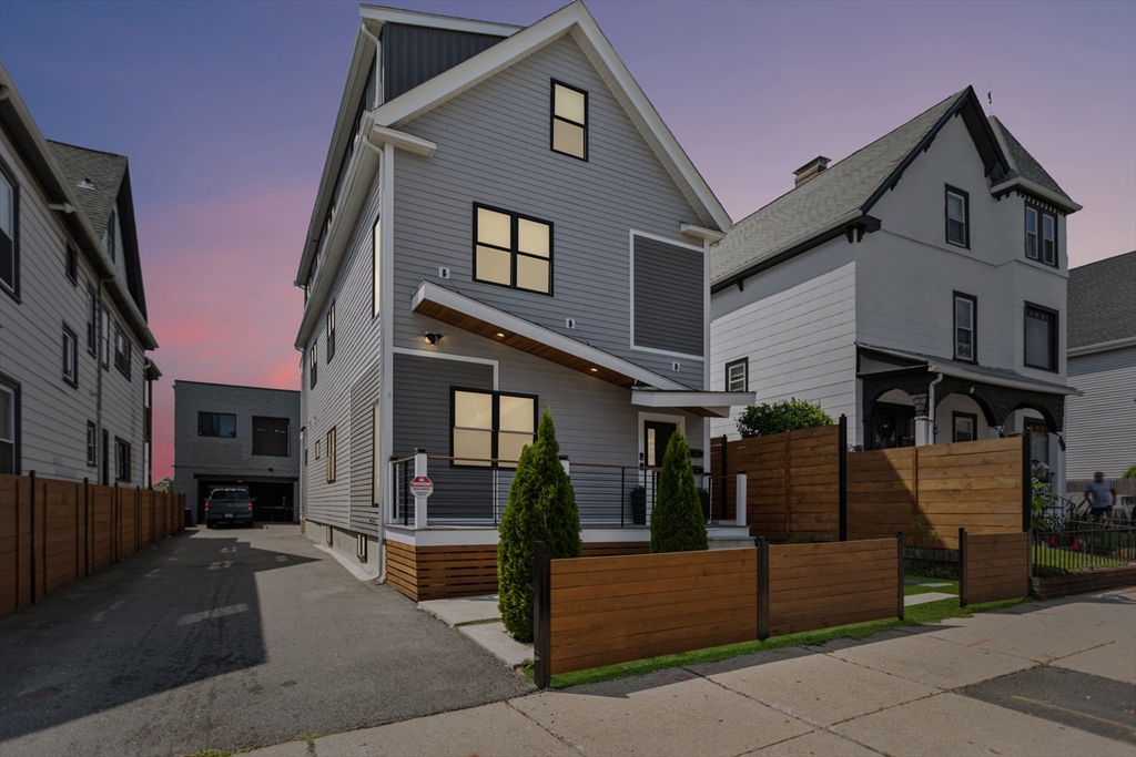 340 Main Street Everett, MA 02149 - Photo 2 of 42 a front view of a house with a garage